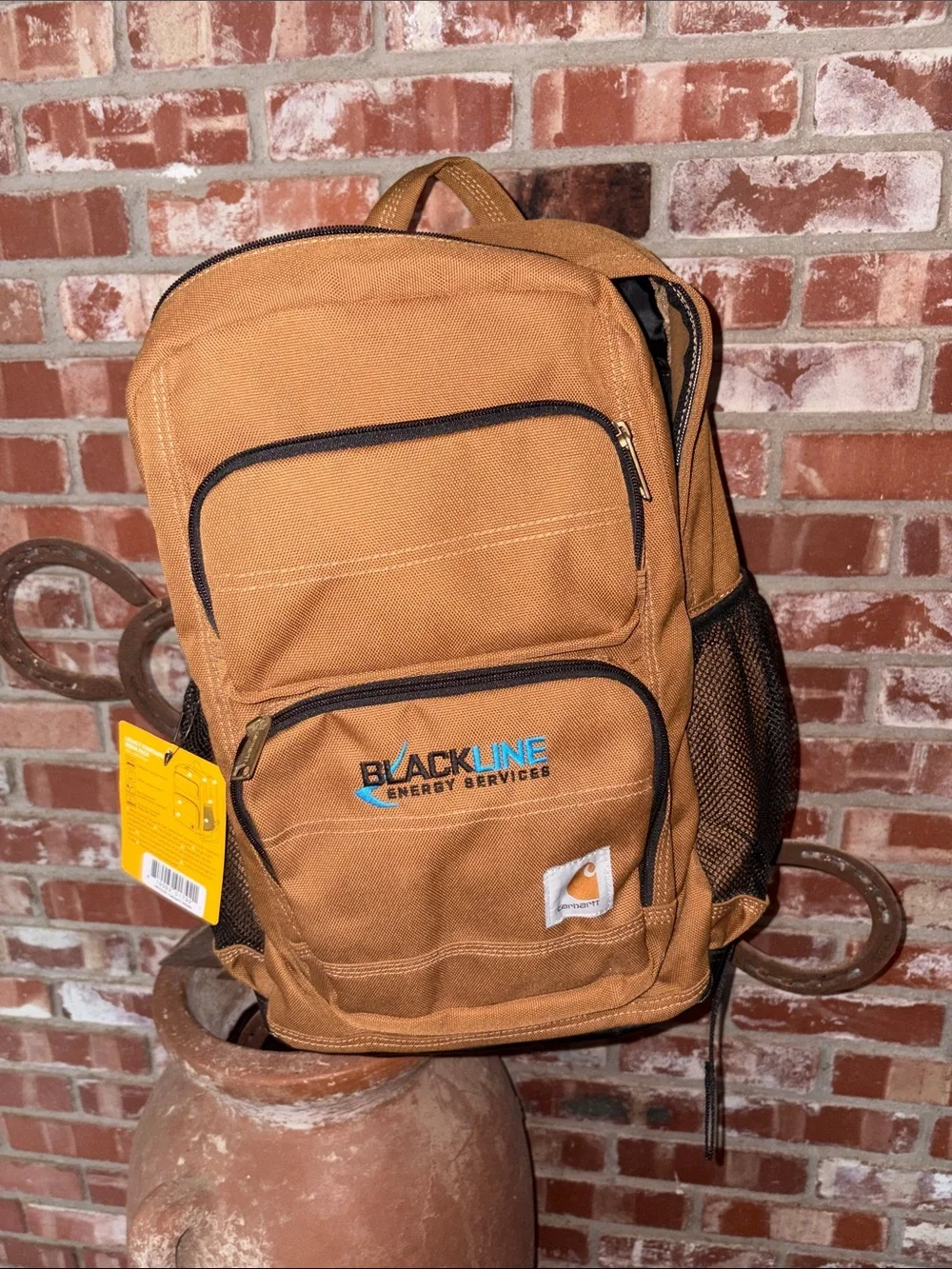 Carhartt Brown Canvas Backpack with Black Trim and Blue Logo